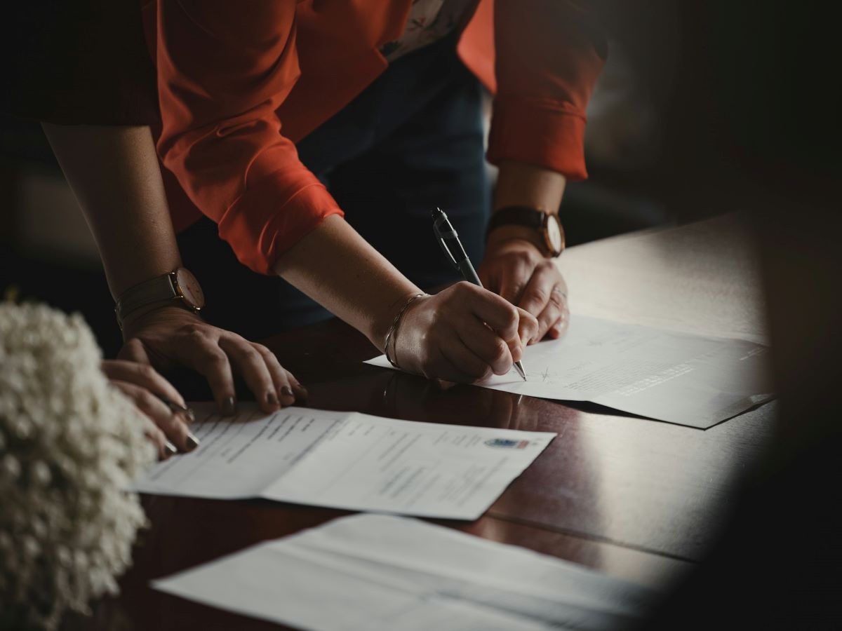 Women wokring on documents in dark environment