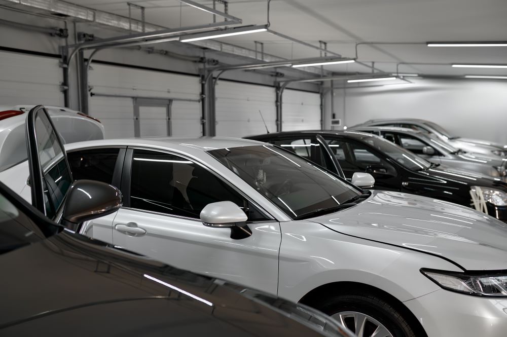 Spacious vehicle storage garage with neatly organized cars