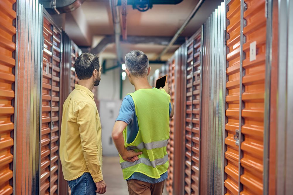 Two men talking in self storage